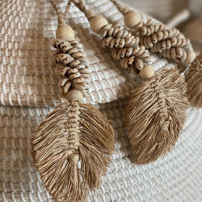 Raffia leaves with cowrie shells