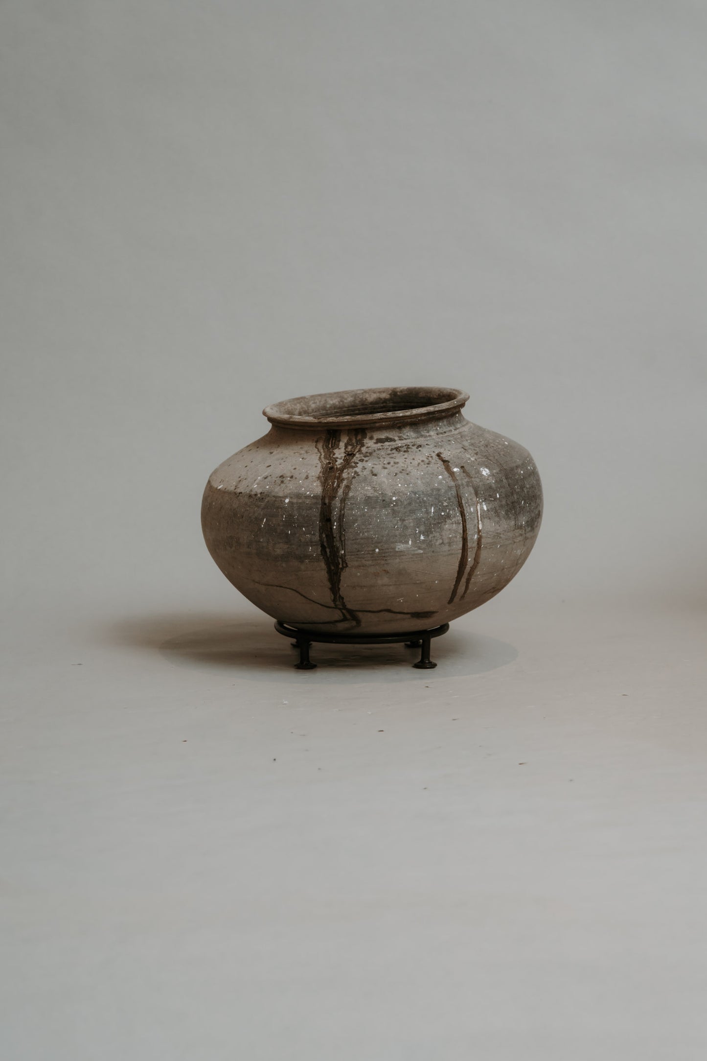 Clay Pot on Iron Stand – A Statement of Stillness and Strength