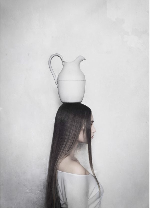 Balance poster with a woman balancing a jug on her head.
